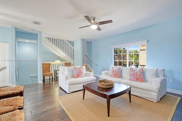 living room featuring dark hardwood / wood-style floors and ceiling fan