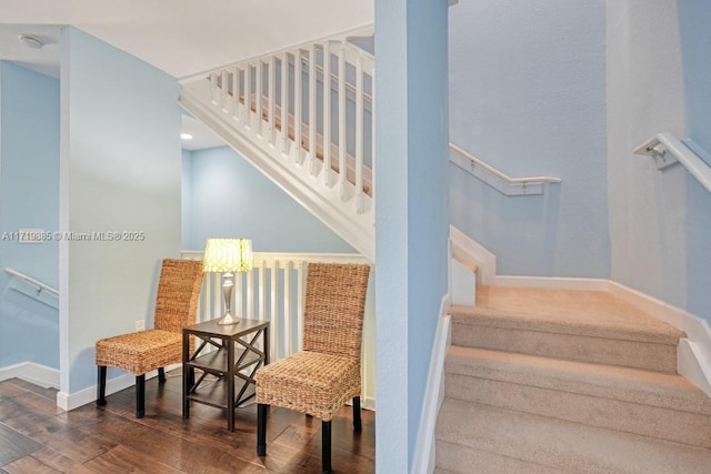 stairs with hardwood / wood-style flooring