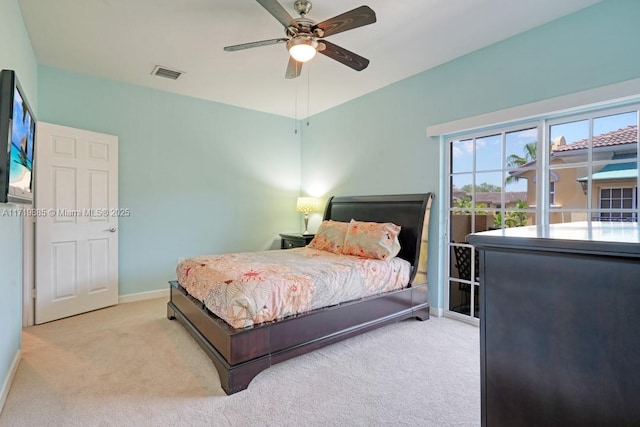 bedroom with ceiling fan and light carpet