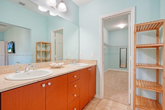 bathroom with tile patterned flooring and vanity