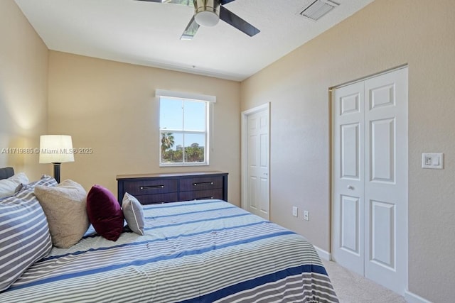 bedroom featuring light colored carpet and ceiling fan