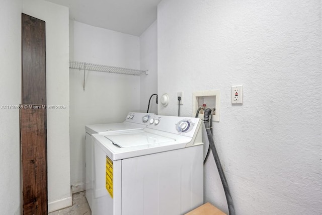 laundry area with independent washer and dryer