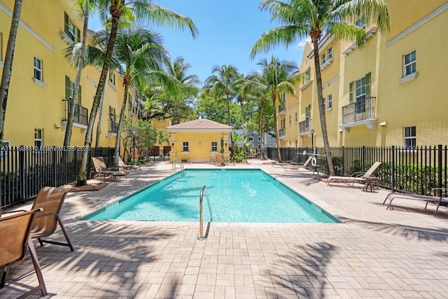 view of swimming pool with a patio area