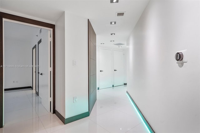 hallway with light tile patterned flooring