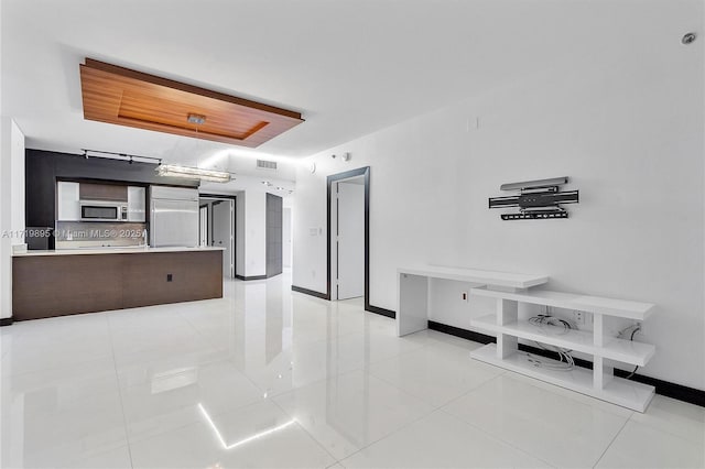 interior space featuring a tray ceiling