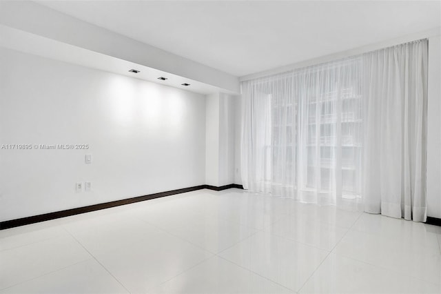 empty room featuring light tile patterned floors