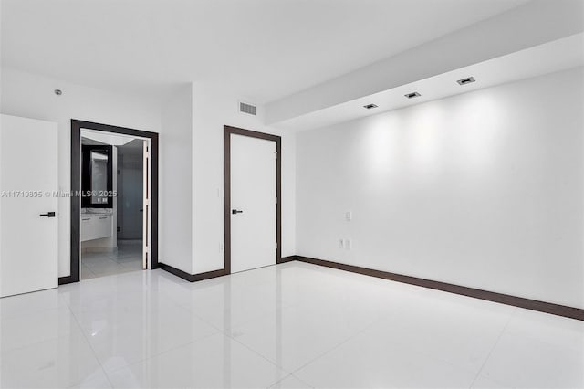 spare room with light tile patterned floors