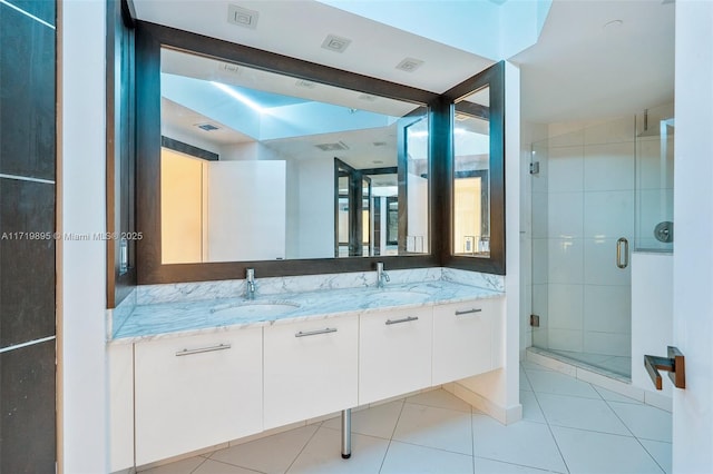 bathroom with tile patterned flooring, beam ceiling, vanity, and a shower with door