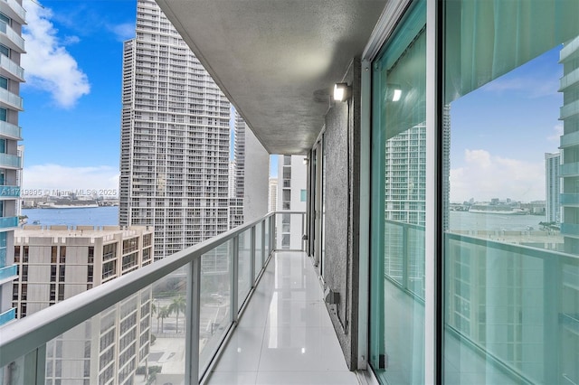 balcony featuring a water view