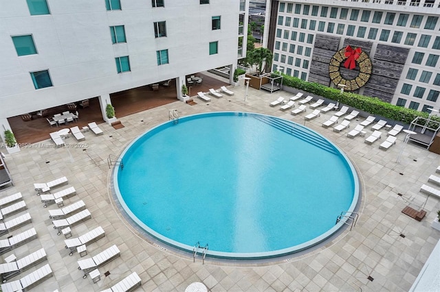 view of swimming pool featuring a patio