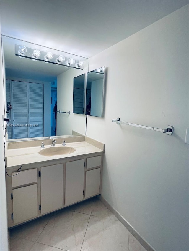 bathroom with tile patterned flooring and vanity