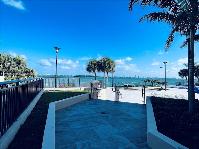 view of patio featuring a water view