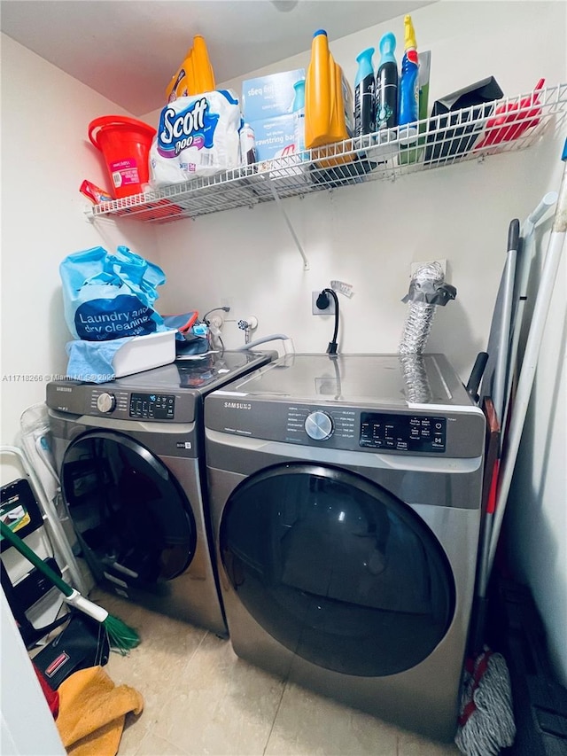 clothes washing area featuring washing machine and dryer