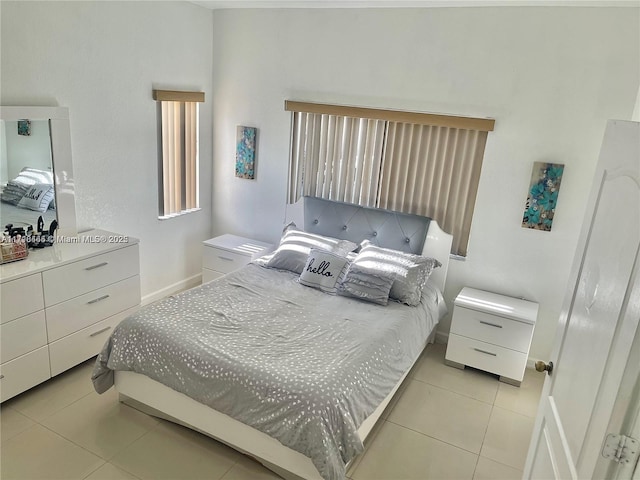 bedroom with light tile patterned floors