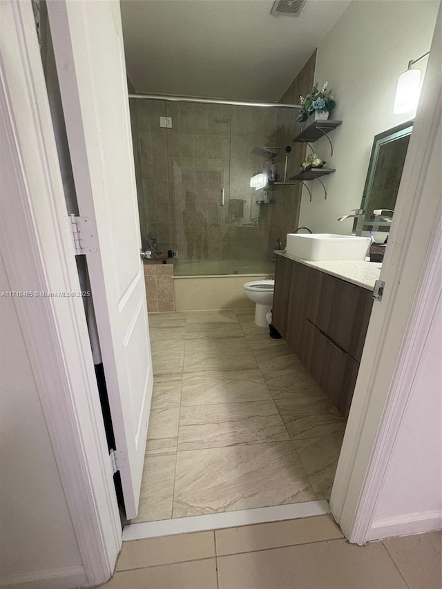 full bathroom with vanity, toilet, and enclosed tub / shower combo