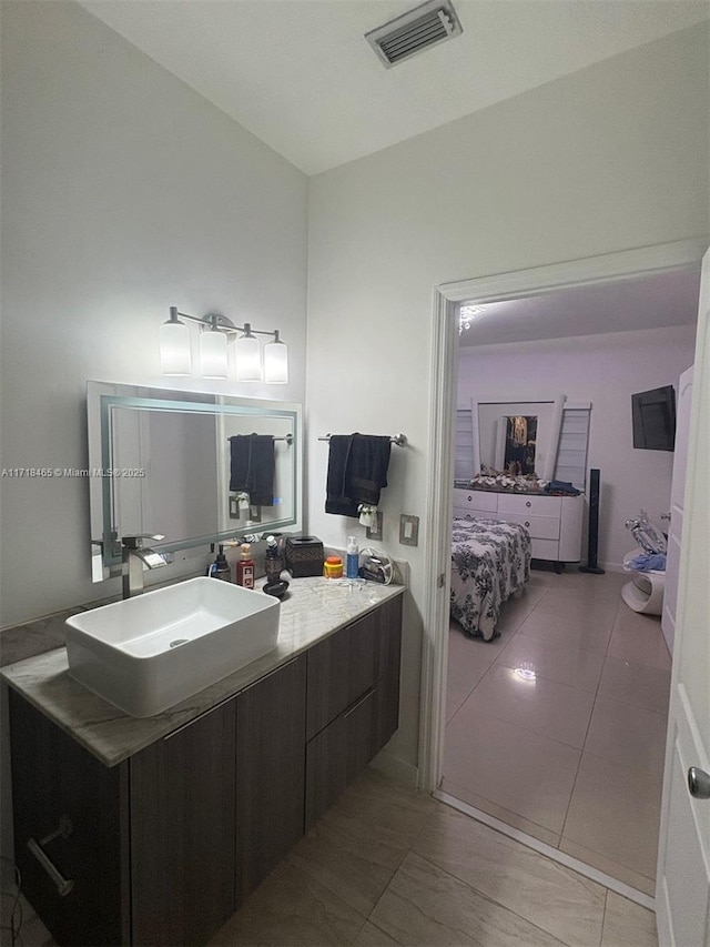 bathroom with vanity and tile patterned floors