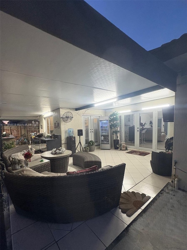 interior space with light tile patterned floors and french doors