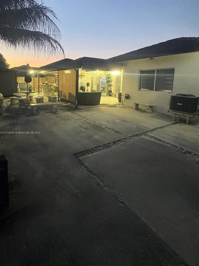 exterior space featuring a patio area and central AC