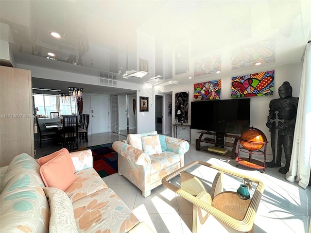 tiled living room featuring a high ceiling