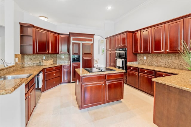 kitchen with stainless steel dishwasher, sink, light stone countertops, stovetop, and double wall oven