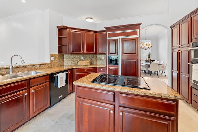 kitchen featuring dishwasher, sink, paneled built in fridge, a notable chandelier, and gas stovetop