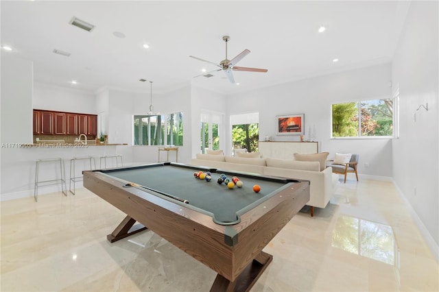 game room with billiards, a healthy amount of sunlight, and crown molding