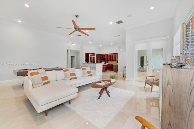 living room featuring ceiling fan, french doors, and ornamental molding