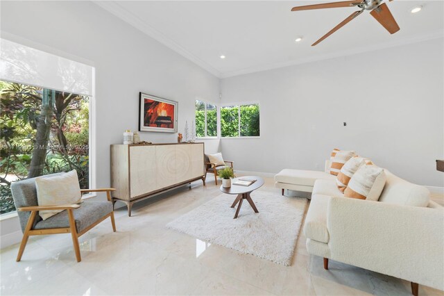 living room with ceiling fan, ornamental molding, and french doors