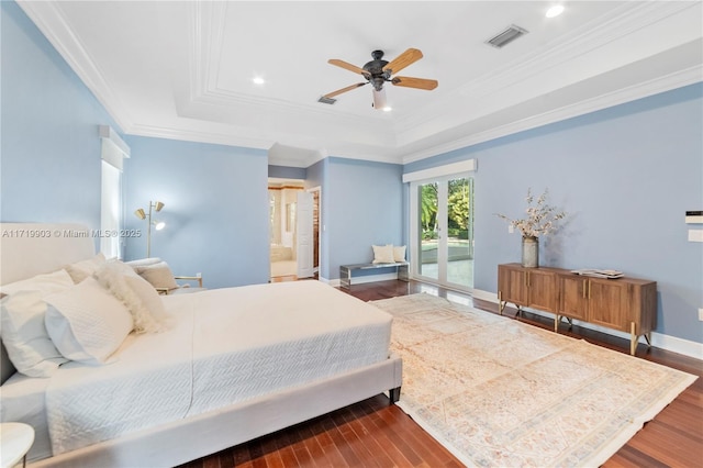 bedroom featuring ceiling fan, connected bathroom, a raised ceiling, and access to outside