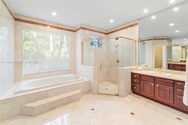 bathroom featuring separate shower and tub, tile walls, tile patterned floors, and vanity