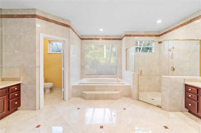 full bathroom with tile walls, toilet, vanity, and plus walk in shower