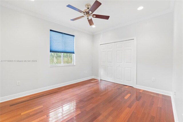 unfurnished room with wood-type flooring, ceiling fan, and ornamental molding