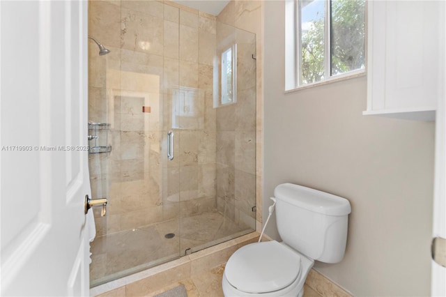 bathroom with toilet and walk in shower