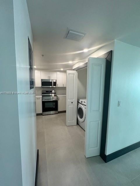 laundry area featuring washer / dryer