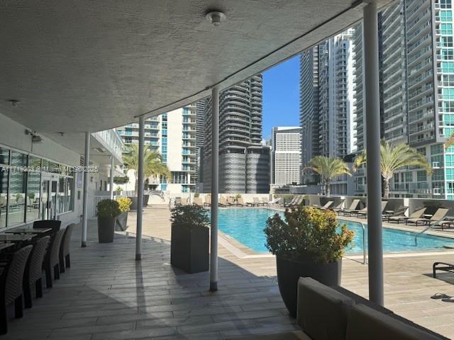 view of swimming pool with a patio area