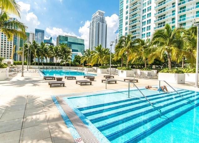 view of pool featuring a patio