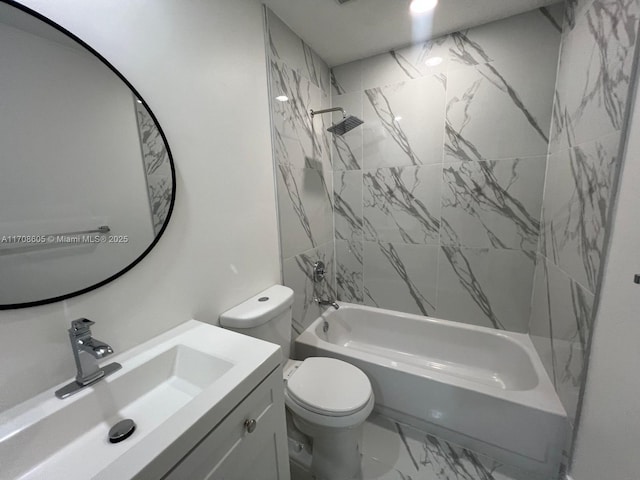 full bathroom with tiled shower / bath combo, toilet, and vanity