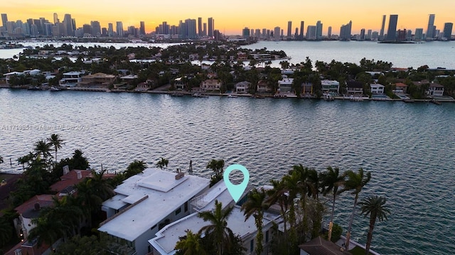 aerial view at dusk with a water view