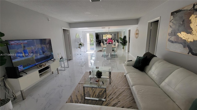 living room with a textured ceiling