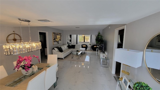 living room featuring an inviting chandelier