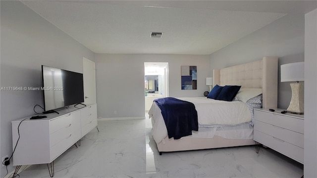 bedroom featuring connected bathroom