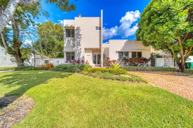 view of front of home with a front lawn