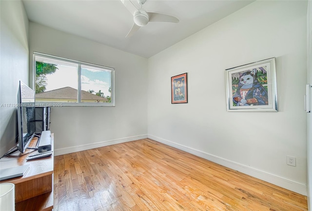 unfurnished office featuring ceiling fan and light wood-type flooring