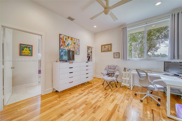 office with ceiling fan and light hardwood / wood-style floors