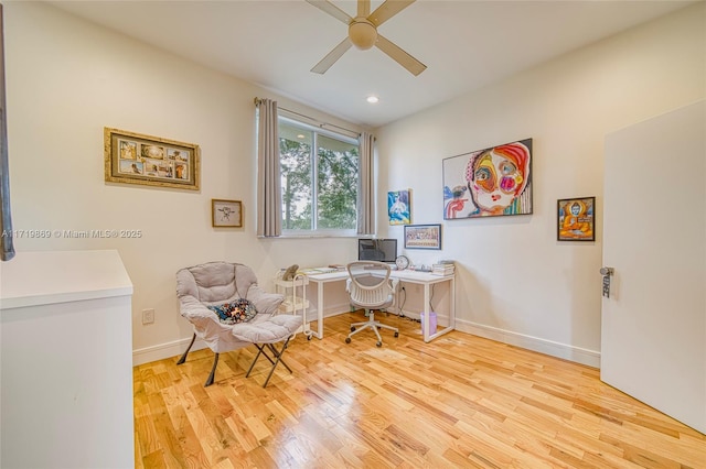 office space with ceiling fan and light hardwood / wood-style flooring