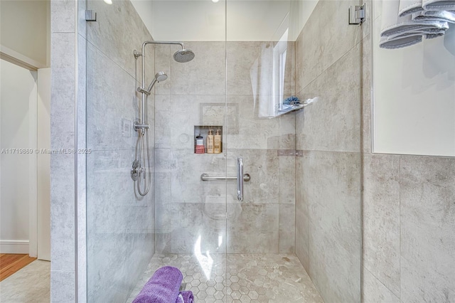 bathroom with a shower with shower door