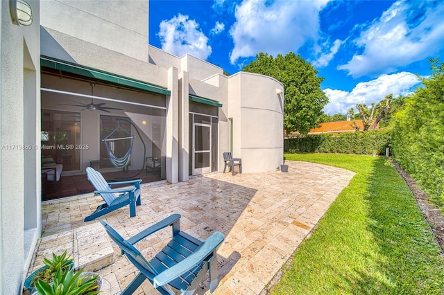 view of patio featuring ceiling fan