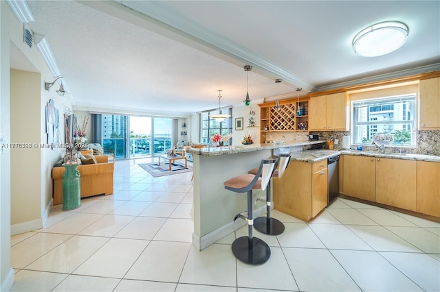 kitchen featuring kitchen peninsula, backsplash, stainless steel dishwasher, light stone counters, and crown molding