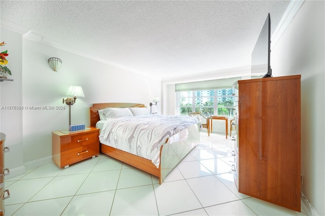 bedroom with ornamental molding, a textured ceiling, and light tile patterned floors