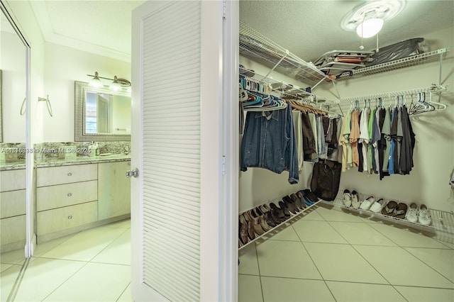 walk in closet featuring light tile patterned floors